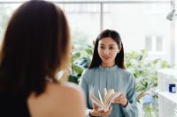 Kaboompics - Asian Woman Talking with a Colleague at Work