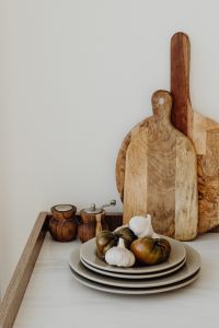 Kaboompics - Vertical Kitchen Counter Background with Garlic, Tomatoes, Wooden Boards and Copy Space