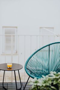 Kaboompics - A stylish garden chair and a small table on the balcony