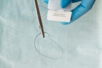Kaboompics - Needle Holder Framing a Black Suture Thread