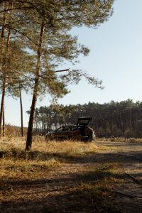 Kaboompics - Off Road Vehicle Parked in a Sunny Forest Clearing