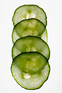 Kaboompics - Overlapping Cucumber Slices on White Background