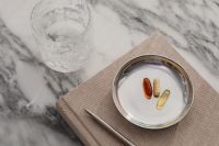 Kaboompics - Supplement Capsules in a Silver Dish on Marble