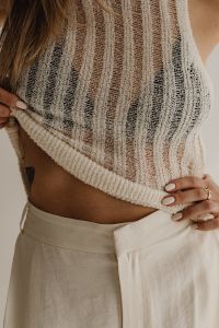 Kaboompics - Close-Up of Textured Knit Top and White Trousers