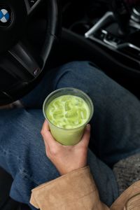 Kaboompics - Iced Matcha Drink in a Woman's Hand Close Up