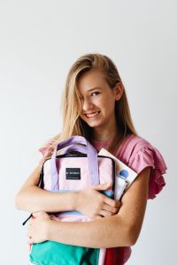 Kaboompics - Teenage Girl Holding Colorful School Backpack