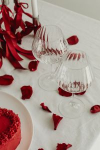 Kaboompics - Crystal Glasses, Red Ribbons, Rose Petals and Heart Cake