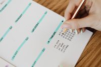 Kaboompics - Hand Writing in a Color-Coded Weekly Planner