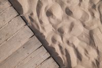Kaboompics - Wooden Boardwalk Beside Rippling Beach Sand