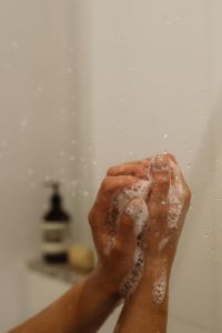 Kaboompics - Lathered Hands Washing with Soap in the Shower