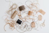 Kaboompics - Rustic Craft Twine And Gift Tags Arranged On White Surface