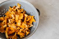 Kaboompics - Close-Up of Fresh Chanterelle Mushrooms in Colander