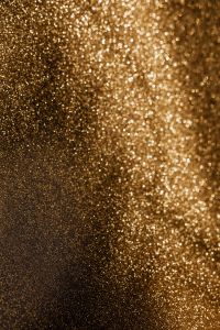 Kaboompics - Dark Gold Glitter Surface With Vertical Light Beam