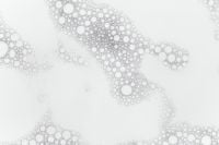 Kaboompics - Horizontal Cosmetic Foam Bubble Trail on White with Open Copy Space, Abstract Skincare Texture Background