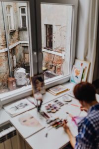 Kaboompics - A woman paints with watercolors