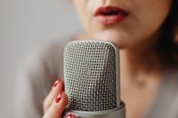 Kaboompics - Macro Microphone Grille and Whispering Lips for ASMR Voice Recording