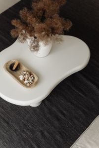 Kaboompics - White Sculptural Coffee Table with Dried Pampas and Decorative Tray