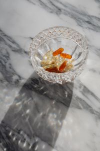 Kaboompics - Vitamins in a Cut Crystal Bowl on Marble