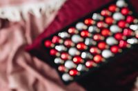 Kaboompics - Red, Silver and Black Christmas Baubles in a Decorative Tray