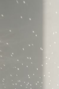Kaboompics - White Wall Background with Dappled Light Reflections