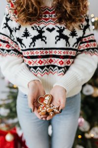 Kaboompics - Festive Gingerbread Cookies Held in Hands by Tree