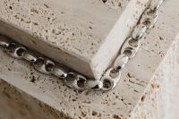 Kaboompics - Close-Up Silver Chain on a Travertine Edge