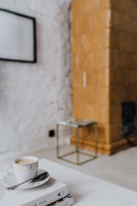 Kaboompics - Cup of coffee on the books