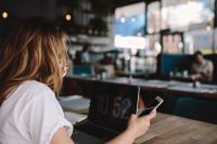 Kaboompics - Young woman working in a cafe
