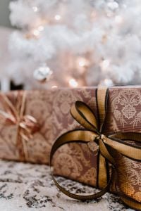 Kaboompics - elegantly wrapped gifts with golden ribbon