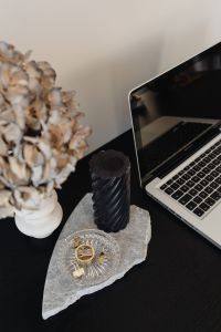 Kaboompics - Close-Up Laptop and Black Candle with Dried Hydrangeas, Minimal Desk Styling