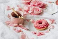 Kaboompics - Pink Iced Donut with Coffee and Rose Petals
