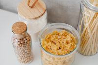 Kaboompics - Overhead View of Wheat Flour, Chickpeas and Pasta in Reusable Glass Pantry Jars