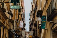 Kaboompics - Pedestrian Alley With Pharmacy Signs and Street Life in Naples