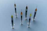 Kaboompics - Aesthetic Medicine Syringes with Colorful Needle Caps