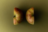 Kaboompics - Apple Halves on Olive Green Background