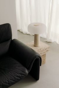 Kaboompics - Black Leather De Sede Sofa with Travertine Table and Mushroom Lamp