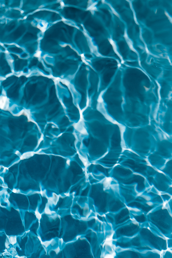 Deep Blue Pool Water with Bold Sunlit Caustics, Vertical Abstract ...