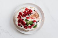 Kaboompics - Overhead Pavlova Cake with Fresh Berries and a Visible Missing Slice