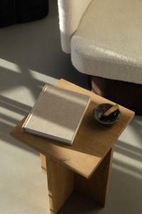 Kaboompics - Calm Reading Nook with Blank Book and Decorative Bowl on Wooden Table