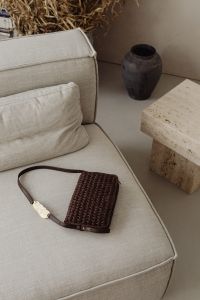 Japandi Fashion Aesthetic with Black Leather Sofa, Travertine and Accessories