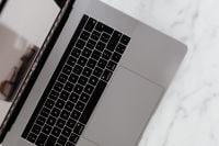 Kaboompics - MacBook Pro 15 laptop and iPhone 11 Pro on a marble table