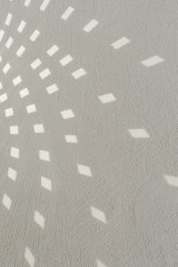White Textured Wall with Curved Light Reflection Pattern