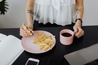 Kaboompics - Working Lunch With Burger, Fries and Coffee at Office Desk