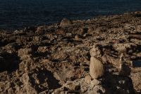 Kaboompics - Dark Rocky Coast with Calm Sea