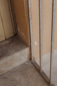 Kaboompics - Weathered Doorway with Terrazzo Threshold and Peeling Paint