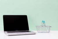 Kaboompics - Laptop and Shopping Basket on Mint Green E-Commerce Background