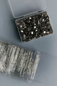 Kaboompics - Clear Boxes of Metal Thumbtacks and Silver Paper Clips