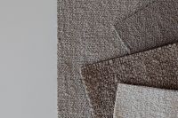 Kaboompics - Close-Up of Overlapping Taupe Bouclé Upholstery Fabric Swatches