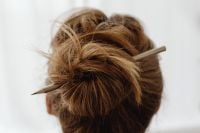 Kaboompics - High Bun Hairstyle Secured with a Pencil
