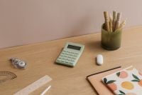Kaboompics - Minimal Wooden Desk with Calculator and Notebooks